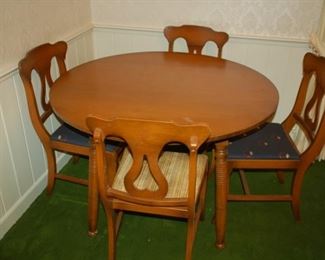 Round dining table with four harp back chairs, 40" W x 29" H
