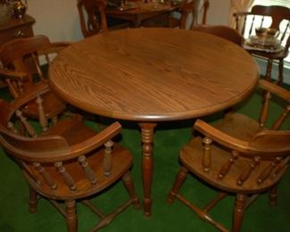 Round Dining table with 6 captain's chairs, 47" W x 29.5" H

