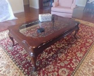 9x12 rug in excellent condition
Cherry finish coffee table with Glass top.