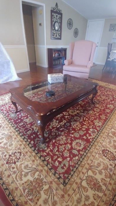 9x12 rug in excellent condition
Cherry finish coffee table with Glass top.