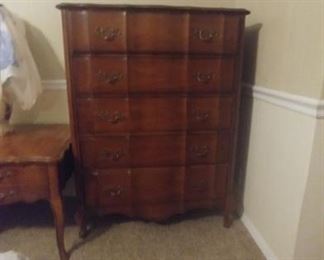 Vintage Serpentine tall chest of drawers
