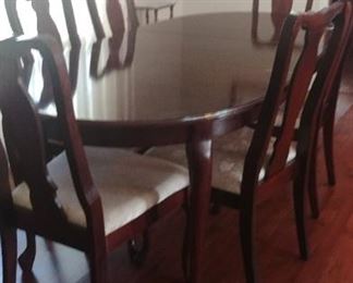 Cherry dining table with eight chairs. (6 shown)