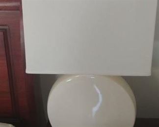 Contemporary off white ceramic lamps with rectangular shades.