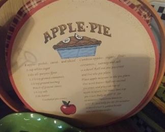 Apple pie lined basket with wood lid and recipe on top with handles to carry it.