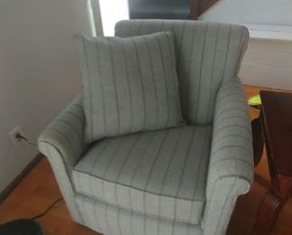 New grey with blue pinstripe swivel chair made by England Furniture Company.