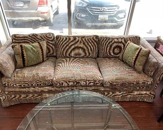 Upholstered 3 cushion couch with skirted front.  Great condition.  7 feet x 3 feet.  $295.