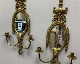 Pair of mirrored brass sconces.  $150. 