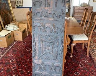 Carved African wooden Granary door.  Dimensions 65" x  17" Made in Senegal.  Rows of bas relief animals and figures.  $1800
