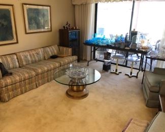 Retro MCM sofa with burled wood trim, awesome Hollywood Regency cocktail or coffee table. Small Italian accent tables, blue and white pottery, stretch glass, Fenton, cut glass and crystal, etc.