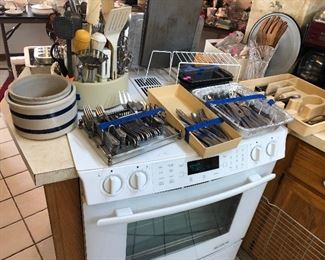 More crockery and look at all that flatware!! 