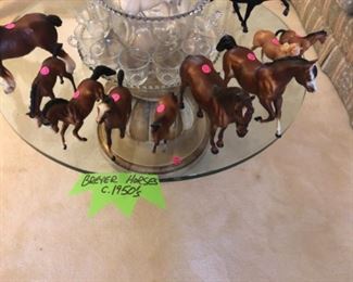 Collection of vintage Breyer Horses posing on a magnificent Hollywood Regency cocktail/coffee table