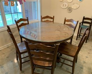 #31	Oak dining table with 6 chairs and glass top  48"	 $150.00 
