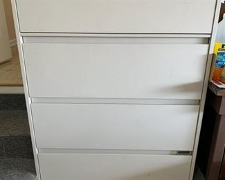 #49	Metal lateral 4 drawer file cabinet with key with contents	 $30.00 
