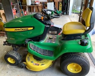 #52 John Deere X300 Riding Lawn Mower with low usage hours $1000