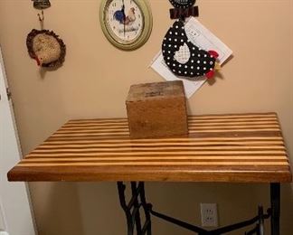 Butcher block top on metal sewing machine treadle base