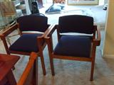 Chair Set
These two chairs have a navy blue and red pin striping pattern on the cushion decorating the finished wood chair.