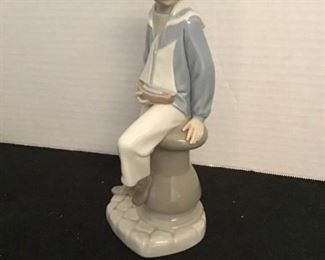 LLADRO Figurine - "Sailor Boy With Yacht" https://ctbids.com/#!/description/share/363934