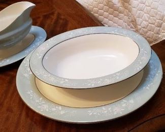 Platter, oval bowl and gravy boat included with 8 place settings.