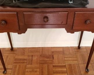 $125 - Item # 64: Accent table, all wood with small "ding" on middle drawer. Vintage, in good condition! 40" long, 17" deep, 30" tall