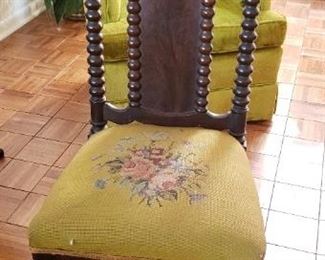 $45 - Item # 65: Antique carved with spindle leg chair. Casters and embroidery set in good conditions. Carvings are great!