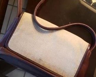 $20 - Item #214A:  Coach purse. Does have some scuff and discoloration. Did not look up the serial numbers. Canvas and leather? ACG-6114