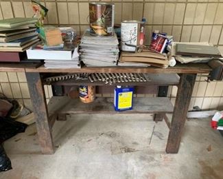 $55 - Item #231: Work bench with iron legs, wood top and attached vice.