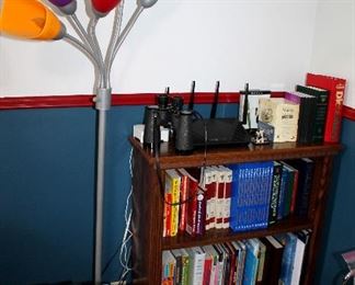 Floor lamp, small bookcase, books, office supplies
