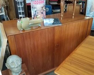 Midcentury Teak Tambour Door Entertainment Cabinet by Povel Dineson , Made in Denmark, Measures approx 54ʺW × 23.5ʺD × 34ʺH, Discounted price now $447.50
***Please note: California sales tax will be charged on all purchases unless you have a valid California resale certificate on file with us.***