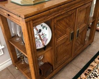 Fold out top serving cabinet