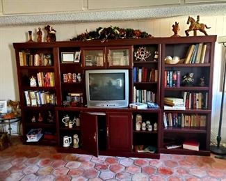 Adjustable Entertainment Center ($300), BOOKS galore, Mexican Pottery, Beer-steins, Medicine Jars