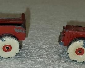 Pair of Red Heavy Metal Toy Tractors

