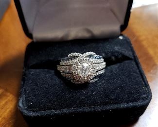 #12 - Neil Lane 14K White Gold / Diamond Ring with Enhancer - center stone .60 carat round diamond, I-1 clarity, near colorless - band has 26 round diamonds - 1.22 CTW. Wrap enhancer has 78 round white / blue diamonds - 0.50 CTW. Size 7 3/4. Paperwork from Kay Jewelers - purchased in 2015.