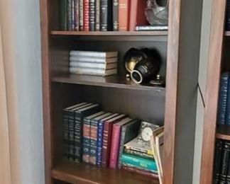 Book Case with Books and Fake Plant
Measures approx 30"x16"x76" Includes Star Hand Made in Greece in 24k Gold Vases, wooden bird, glass basket, and approx 80 books