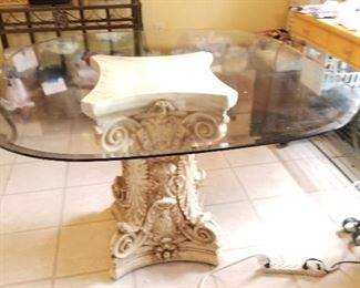 Glass top table with pedestal base