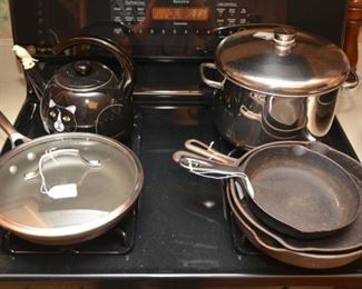 cast iron - one is a small logo Griswold, Calphalon, stock pot