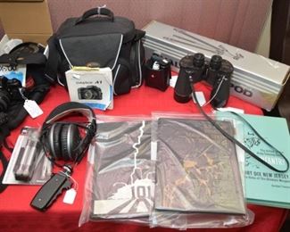 camera outfil, head set, tripods, 1943 WW2 binoculars, Vietnam era unit books
