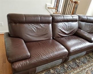 dark brown leather, reclining sectional sofa. 3 pieces, 2 side pieces both recline-backs & legs. Sofa by Natuzzi, 2011.  Leather sofa: $1,400.00.   Rug is SOLD