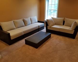 Lower Level: casual outdoor resin sofa, loveseat and coffee table.   SET: $325.00