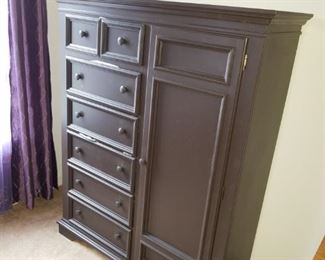 Bedroom #2: 
black cabinet/dresser, w/ 6 drawers & 1 door with matching night table.  Cabinet: 65.00