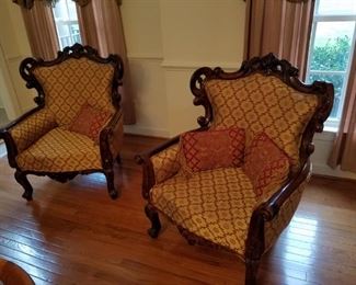 pair ornate carved chairs, 34" wide x 29" deep x 41" tall.     $425.00 pair