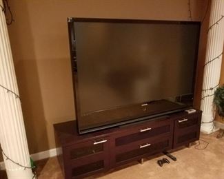 Lower Level: TV cabinet: 77" x 22" x 22.5" tall.  Large TV-BUYER MOVES.  TV Cabinet: $60.00      TV: $75.00