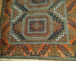 area rug detail.    "orange" rug: $175.00