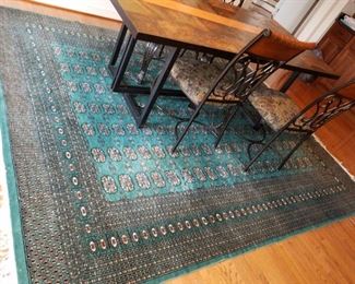 colored tile top dining table w/ metal legs/base and 4 upholstered chairs.    Table w/ chairs: $100.00.    Rug is sold