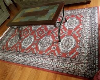 Den-area rug from India (72" x 8' 7") & tile top coffee table w/ metal legs (48" x 28").    $125.00