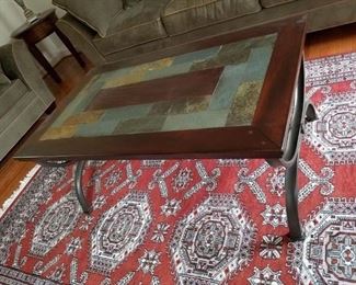area rug & tile top coffee table w/ metal legs    Rug: $125.00.  Table: $75.00