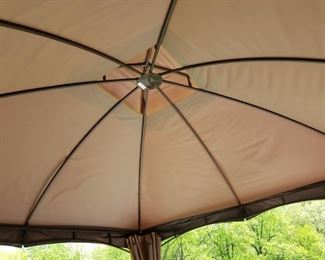Hampton Bay outdoor canopy. 10' x 12', sides tie back/slide closed. Heavy construction w/ 4" metal poles w/ weights, hook inside for light fixture (not included), opening height is 7'. One year old!     $175.00