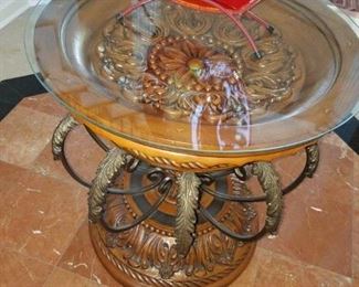 Entrance: metal/carved wood table w/ glass top. 28" round x 30.5" tall.    Round table:  $65.00