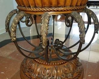 Entrance: metal/carved wood table w/ glass top. 28" round x 30.5" tall.     Round table:  $65.00