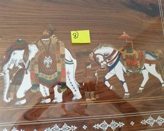 Master Bedroom: large dresser/cabinet: carved & bone colored inlaid w/ elephant scenes. #8.  With glass on top. 7 drawers. From India.   Dresser #8 (elephants): $425.00.  95" long x 23" deep x 30" tall