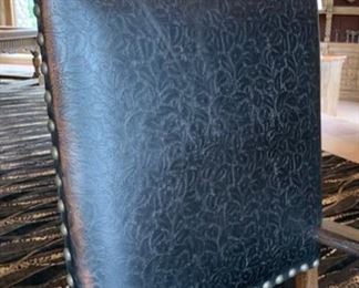 2pc Rustic Hand Tooled Leather, Carved Wood Highback Chairs	54x24.5x24.5. Seat Height: 21in	HxWxD	SC110